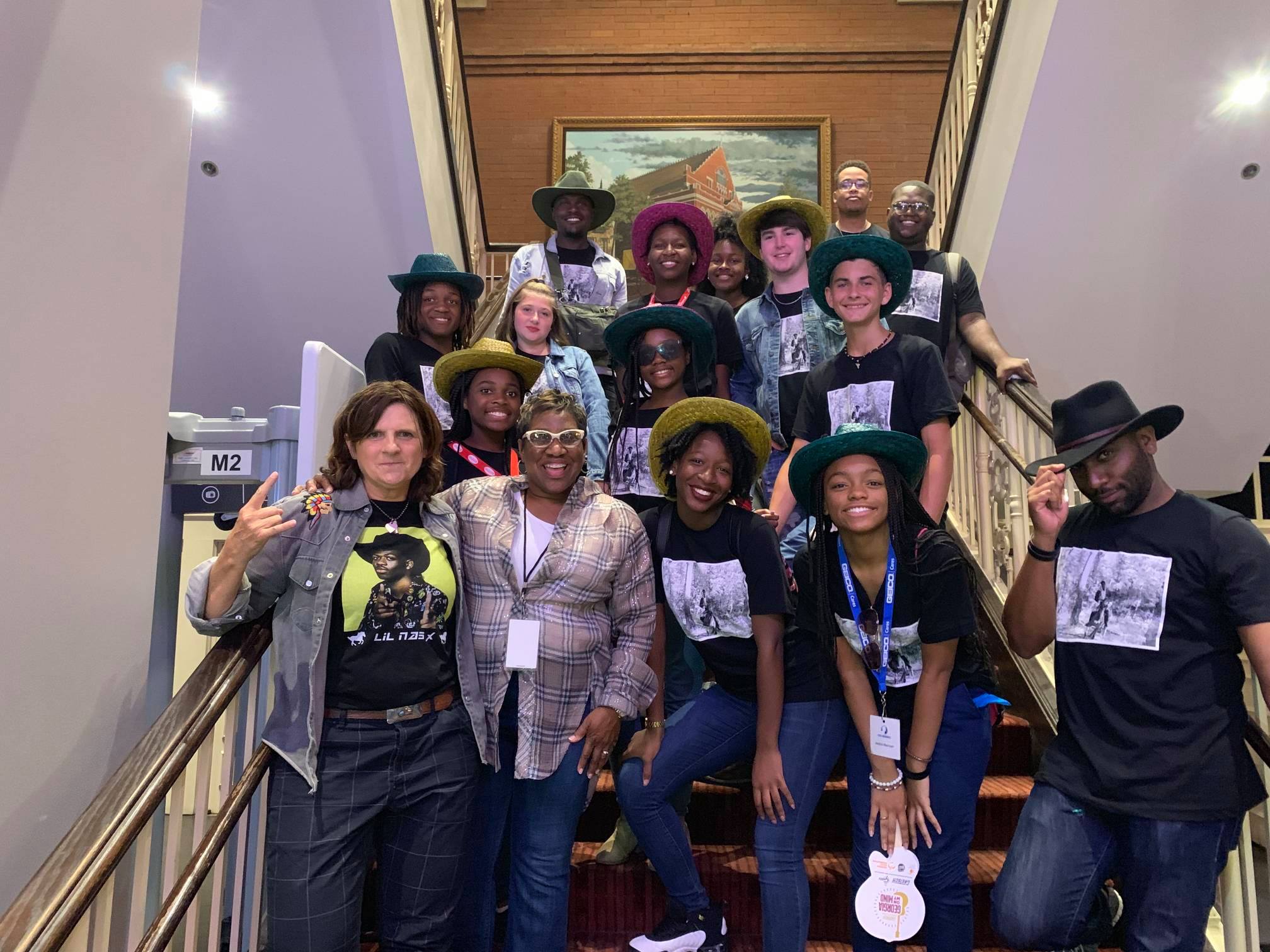 The Dream Choir poses backstage with Amy Ray of the Indigo Girls at the Georgia On My Mind concert at the Ryman Auditorium, July 2019